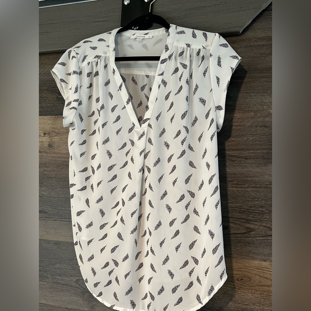 M white blouse with navy blue feathers